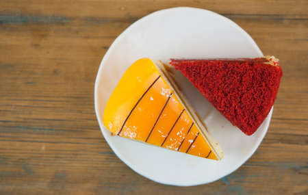 Festive cake. Portion of cake. A piece of cake lies on a wooden table.の写真素材