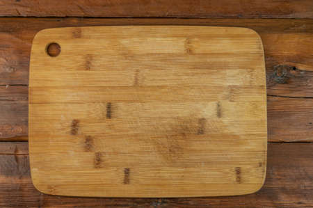 Kitchen wooden board on wood backgroundの写真素材
