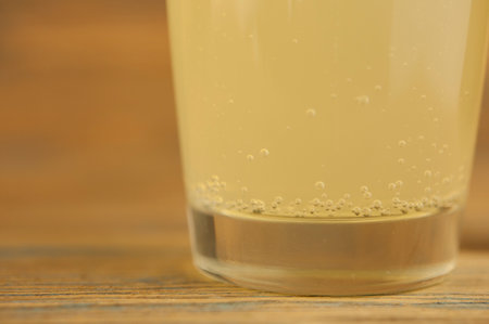 Lemonade on a glass cup on wood tableの写真素材