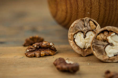 Bowl of walnuts on a wooden backgroundの写真素材