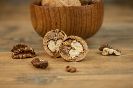 Bowl of walnuts on a wooden backgroundの写真素材