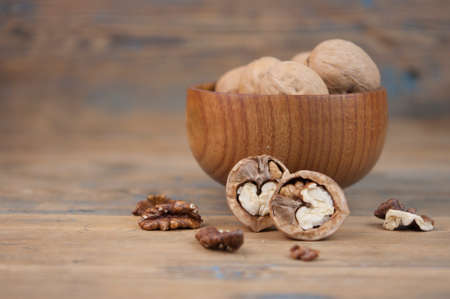 Bowl of walnuts on a wooden backgroundの写真素材