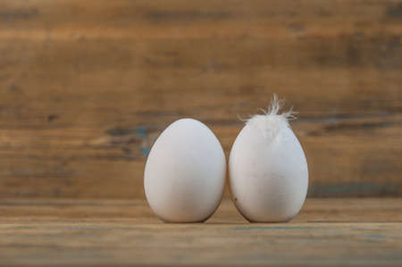 Two salted eggs on a wooden board.の写真素材