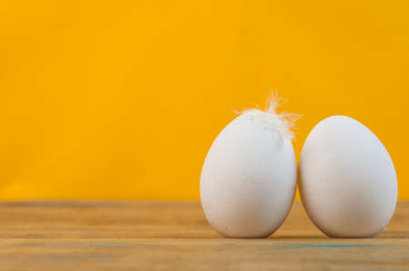 Two salted eggs on a wooden board.の写真素材