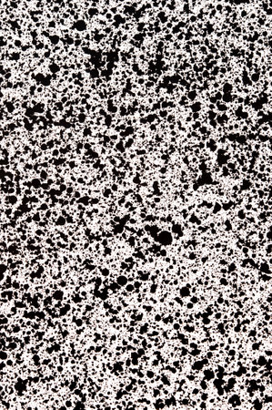 Splattered pf black ink drops on white backgroundの写真素材