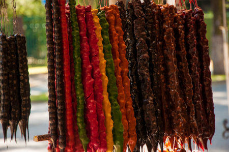 Churchkhela is a traditional Georgian homemade sweets with nuts and grape juice on the local food marketの写真素材