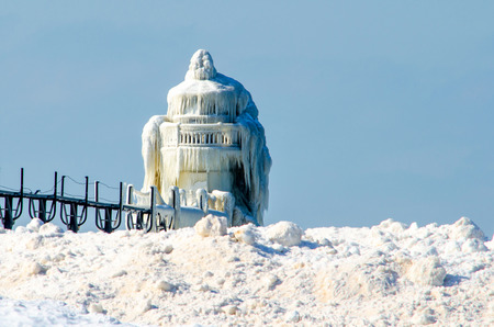 The light house in St Joseph Michigan becomes a natural sculpture of ice with help by mother natureの写真素材
