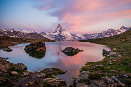 Colorful summer panorama of the Matterhorn pyramid and Stellisee lake. Few minutes before sunrise. Great june outdoor scene in Swiss Alps, Zermatt, Switzerland, Europeの写真素材