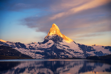 Colorful summer panorama of the Matterhorn pyramid and Stellisee lake. Few minutes before sunrise. Great june outdoor scene in Swiss Alps, Zermatt, Switzerland, Europeの写真素材