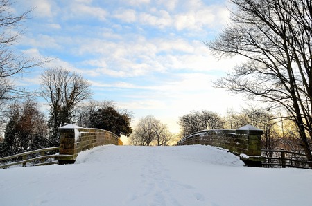 A bridge covered in snow im winterの写真素材