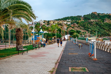 Alanya, Turkey - October 21, 2020: Outdoor workout area with exercise machines on the promenade near Kleopatra Beach in Alanya. A place for sports and recreation with a beautiful view of the mountainのeditorial素材