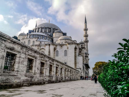 Suleymaniye Mosque in Istanbul (Turkey) on a cloudy summer-autumn day, close-up. White stone walls of an ancient muslim temple in a turkish tourist townの写真素材
