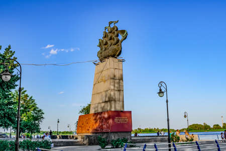 Kherson, Ukraine - July 22, 2020: Monument to the first shipmen on the Ushakova Avenue in Kherson. Sculpture of a ship on a high pedestal on the promenade of the Dnieper Riverのeditorial素材