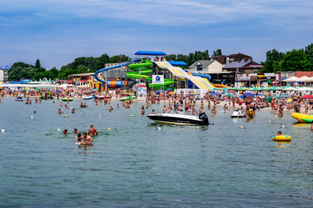 Zaliznyi Port, Ukraine - July 23, 2020: View from the Black Sea to the beach in Zalizny Port. A lot...