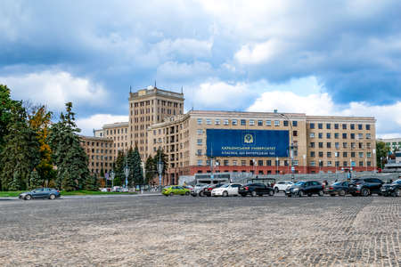 Kharkiv, Ukraine - October 20, 2020: View from Freedom Square to the building of V.N. Karazin Kharkiv National University. City landscape with cars parked near the old building on a cloudy autumn dayのeditorial素材