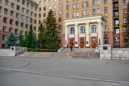 Kharkiv, Ukraine - October 20, 2020: Entrance to V.N. Karazin Kharkiv National University. Monuments of famous people near the stairs against the background of a beautiful old facadeのeditorial素材