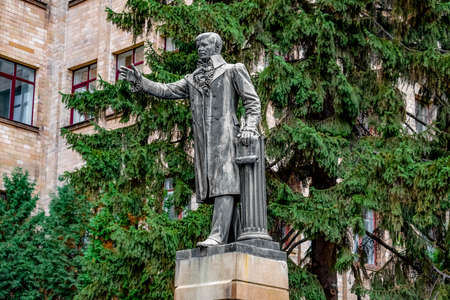 Kharkiv, Ukraine - October 20, 2020: Monument to Vasily Karazin near the entrance to the main building of V.N. Karazin Kharkiv National University. Male sculpture on a pedestal. Authors - I.I. Andreoletti, A.N. Beketov (1905)のeditorial素材