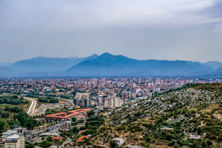 Panorama of Shkoder, Albania - aerial view. Beautiful cityscape with a mountain on the horizonの写真素材