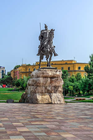 Tirana, Albania - June 21, 2021: Skanderbeg Monument on the Skanderbeg Square in Tirana. Sculpture of the national Albanian hero riding a horse on the backdrop of the urban landscape on a summer dayのeditorial素材