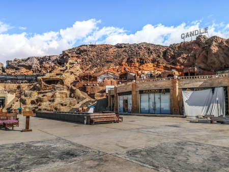 Sharm El Sheikh, Egypt - January 19, 2020: View from the square at Candle Cafe in Sharm El Sheikh. Egyptian restaurant built into the rock and Candle sign above the mountainのeditorial素材