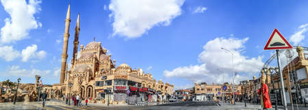 Sharm El Sheikh, Egypt - January 19, 2020: Widescreen panorama of the Old Market in Sharm El Sheikh. Cityscape of an Egyptian tourist town with the Al Sahaba Mosque in the middle of a city streetのeditorial素材