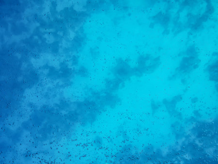 Natural water texture with air bubbles. Turquoise clean aqua background. View of the sea depth through the glassの写真素材