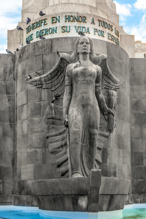 Santa Cruz de Tenerife, Spain - November 24, 2021: Winged female figure representing Victory on Monumento a los Caidos in Santa Cruz de Tenerife. Pigeons sit on the sculptural elements of the memorialのeditorial素材