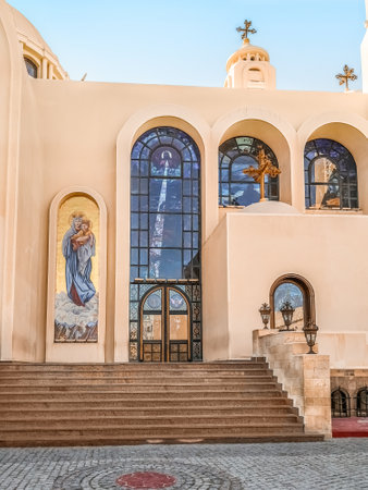 Sharm El Sheikh, Egypt - January 18, 2020: Entrance to modern El sama Eyeen Coptic Church in Sharm El Sheikh. Stone staircase on the background of the facade with large arched stained glass windowsのeditorial素材