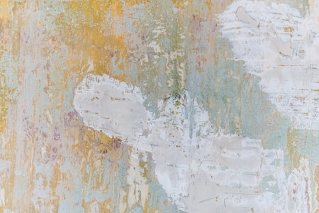 Texture of an old shabby wall with many layers of paint. Multicolored abstract light grunge plaster...