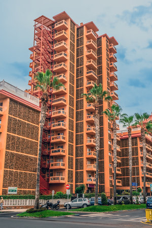 Puerto de la Cruz, Spain - November 25, 2021: Modern architecture of Puerto de la Cruz in the Canary Islands, vertical. Multi-storey residential building with balconies on Avenida Melchor Luz streetのeditorial素材
