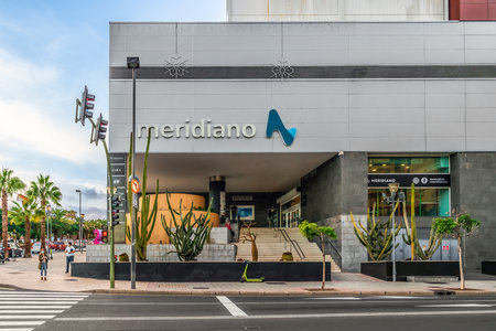 Santa Cruz de Tenerife, Spain - November 24, 2021: Meridiano Shopping Center in Santa Cruz de Tenerife. Entrance to a modern building with cacti in the flower bedsのeditorial素材