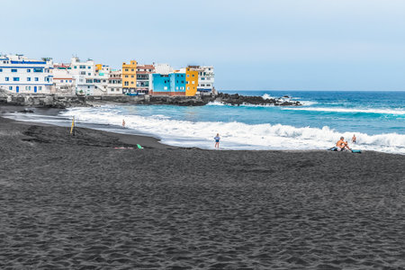 Beautiful exotic panorama of Playa Grande beach with black sand in Puerto de la Cruz in the Canary Islands, Spain. Coastline of the Atlantic Ocean. Seascape during a stormの写真素材