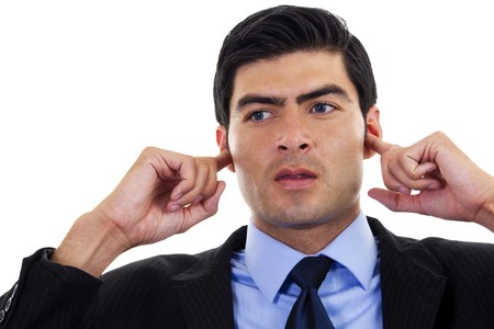 Stock image of businessman covering his ears with his hands, over white background