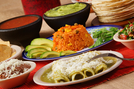 Stock image of traditional mexican food green enchilada dinnerの写真素材