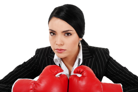 Stock image of businesswoman with boxing gloves isolated on white backgroundの写真素材