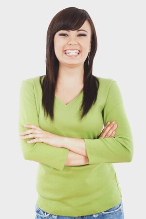 Stock image of happy, smiling woman with arms crossedの写真素材