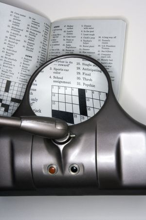Vision magnifying glass used to view crossword puzzle.の写真素材
