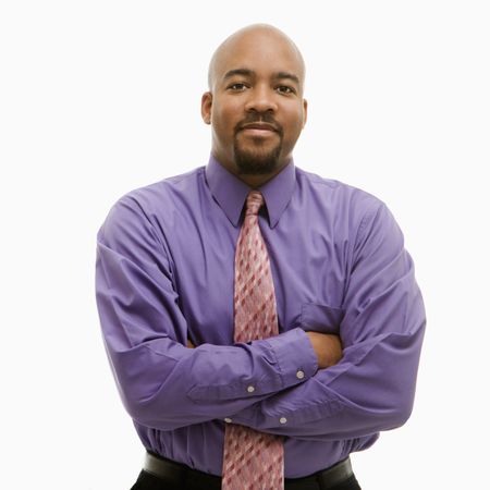 African-American businessman portrait with arms crossed looking at viewer.の写真素材