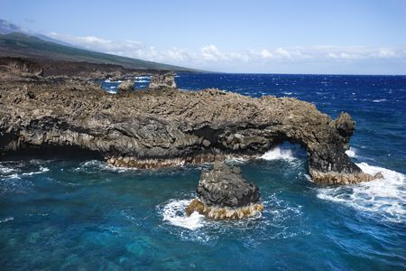 Aerial of Pacific ocean and Maui, Hawaii coast with lava rocks.の写真素材
