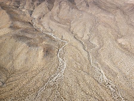 Aerial view of torrid California desert with rocky landforms.の写真素材