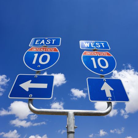 Highway interstate 10 sign with arrows pointing east and west.の写真素材