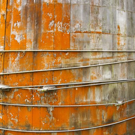 Close up of round structure with wood panels and peeling orange paint.の写真素材