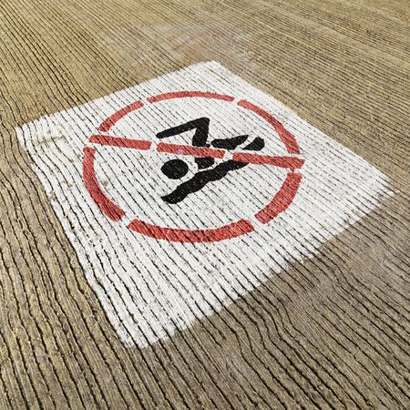 No swimming sign painted on cement.の写真素材