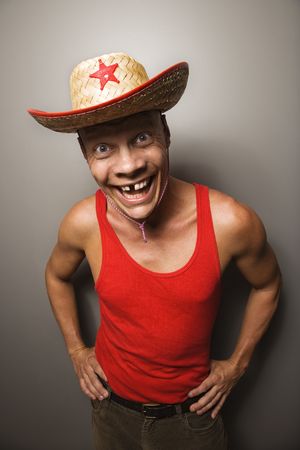 Portrait of a Mid-adult Caucasian male wearing straw hat with funny expression.の写真素材