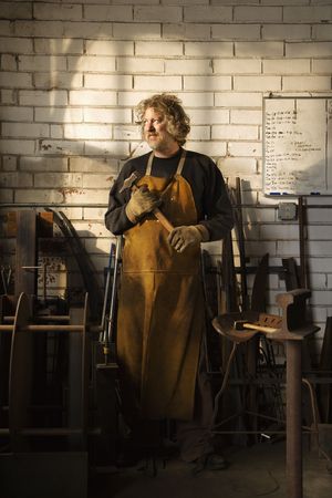 Caucasian male metalsmith portrait.の写真素材
