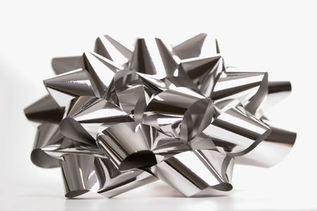 Still life of big shiny silver Christmas bow.の写真素材