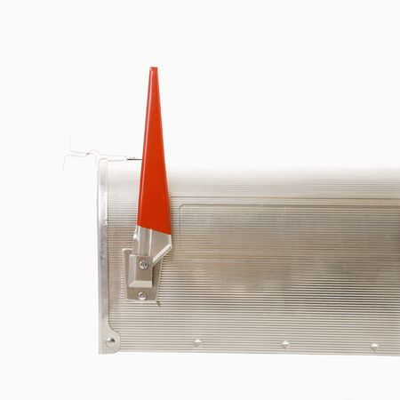 Shiny silver metal mailbox with flag up.の写真素材