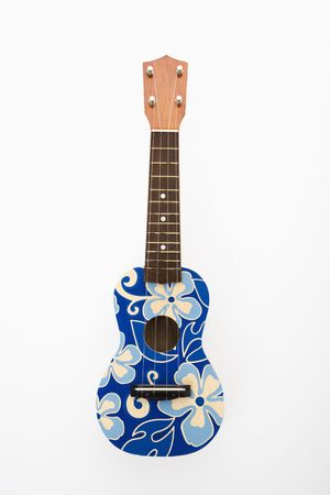 Ukulele painted with blue flowers in Hawaiian pattern.の写真素材