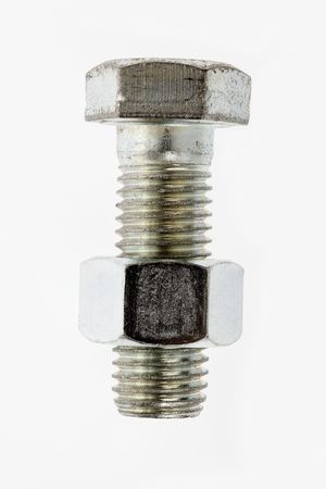 Nut and bolt against white background.の写真素材