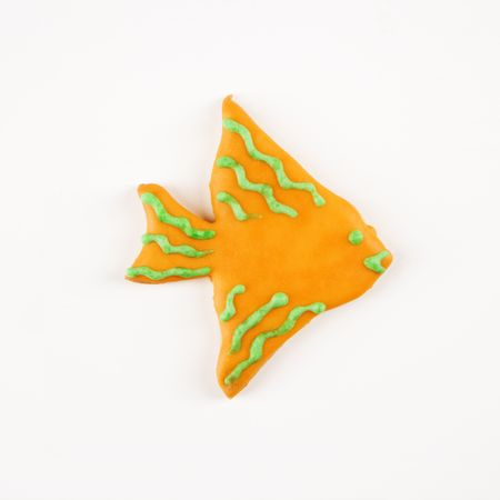Sugar cookie in shape of a fish with decorative icing.の写真素材